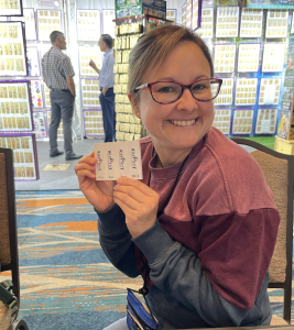 A Wild West Shirt Company customer excited about our new, branded post-it notes to mark up this season's design catalog.
